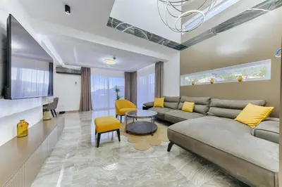 a living room with a couch and a table at Villa AS in Bar