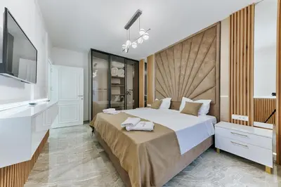 a bedroom with a large bed and a flat screen tv at Villa AS in Bar