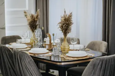 a dining room table with plates and wine glasses at Villa AS in Bar