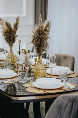a table with plates and wine glasses on it at Villa AS in Bar
