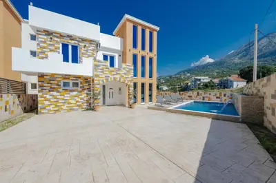 a villa with a swimming pool and a mountain at Villa AS in Bar