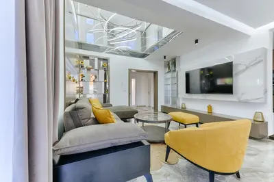a living room with a couch and a tv at Villa AS in Bar