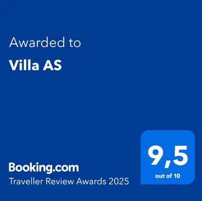 a blue sign with the text awarded to villa as at Villa AS in Bar
