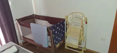 two baby cribs are sitting in a room at Orahovo stone vilas in Virpazar