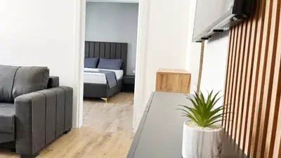 a living room with a couch and a bed at SUPREME Luxury HOTEL in Ulcinj
