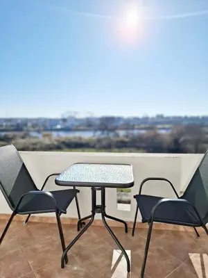a table and chairs on a balcony with a view at STANDART Premium in Ulcinj