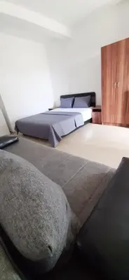 a bedroom with two beds and a pillow on the floor at STANDART Premium in Ulcinj