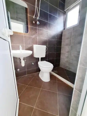 a bathroom with a toilet and a sink at STANDART Premium in Ulcinj