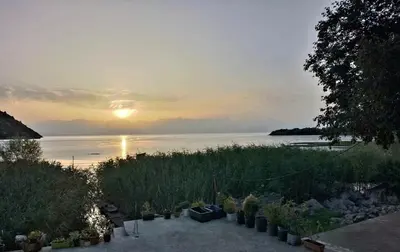 a view of a sunset over a body of water at Apartment Lake Oasis ''Oko'' in Krnjice