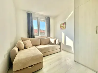 a living room with a couch and a window at Villa Petra Zagora in Zagora