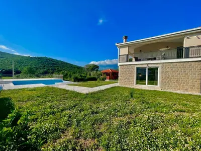 a house with a yard with a swimming pool at Villa Petra Zagora in Zagora