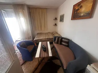 a room with a couch and a table and a bed at A-D free wi-fi internet, air conditioner,free parking in Podgorica