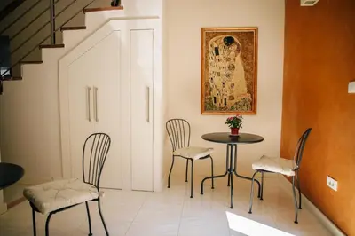 a dining room with a table and chairs at Filip Deluxe Rooms in Kotor