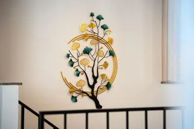 a wall art of a tree on a wall at Cosy Duplex near Bus Station in Budva