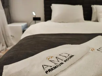 a bed with two towels on top of it at AMD Premium rooms Budva in Budva