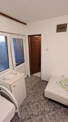 a room with two beds and a door at Private guest-house Gutic in Sutomore