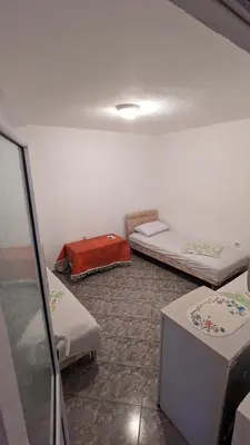 a room with three beds in a room at Private guest-house Gutic in Sutomore