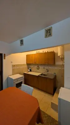 a kitchen with a sink and a counter top at Private guest-house Gutic in Sutomore