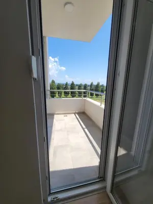 a sliding glass door with a view of a balcony at Angie's in Ulcinj