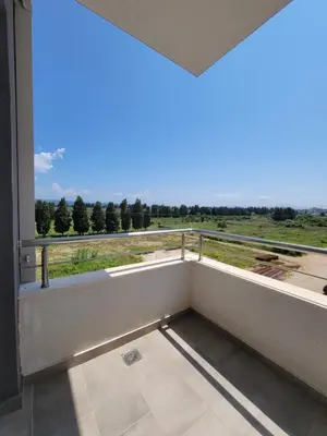 a balcony with a view of a field at Angie's in Ulcinj