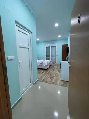 a room with a room with a bed and a door at L&I Villa in Ulcinj