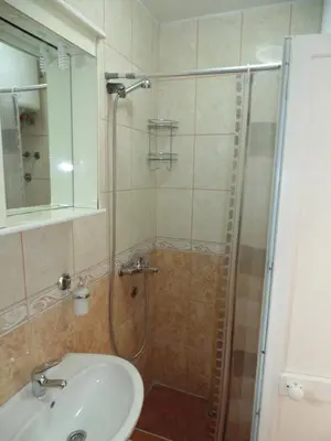 a bathroom with a shower and a sink at Apartments Macaso in Bar
