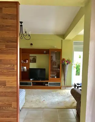 a living room with a flat screen tv at Grlica in Bar