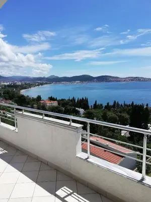 a balcony with a view of a body of water at Grlica in Bar