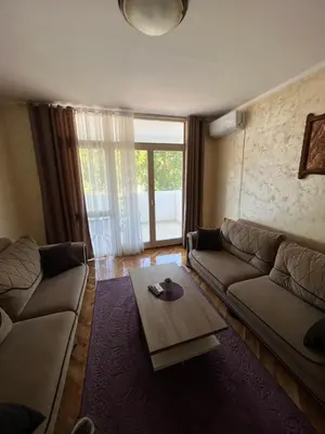 a living room with a couch and a coffee table at Sutomore Centar in Sutomore