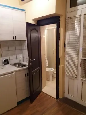 an open door to a bathroom with a toilet at V&J apartments in Podgorica