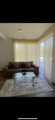 a living room with a couch and a coffee table at Casa Gazi in Ulcinj