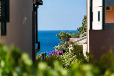 a view of the ocean from a house at Petrovac Holiday Apartments 2 in Petrovac na Moru