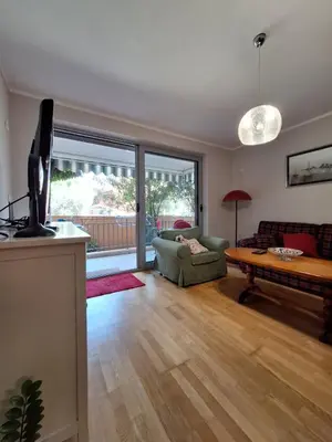 a living room with a couch and a table at Ljiljana in Petrovac na Moru