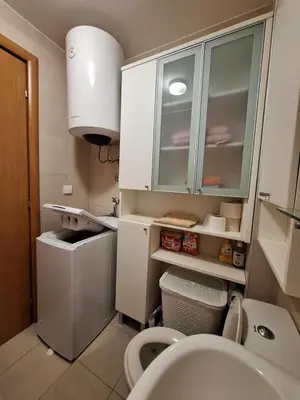 a small bathroom with a sink and a toilet at Ljiljana in Petrovac na Moru