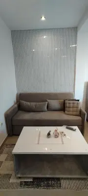 a living room with a couch and a table at Kahari Apartments in Ulcinj