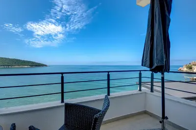 a balcony with a view of the ocean at Sea Breeze Apartment in Kruče