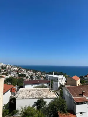 a view of the ocean from the roofs of buildings at Apartments Andrović in Ulcinj