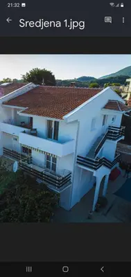 a rendering of a white house with stairs at Apartments Andrović in Ulcinj
