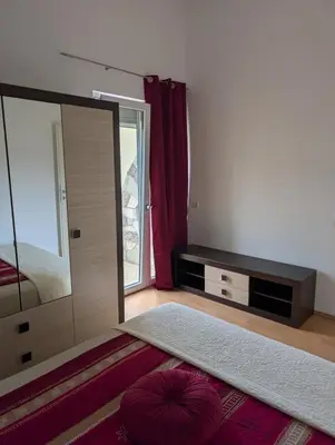 a bedroom with a large mirror and a bed at Vila Anja in Dobra Voda