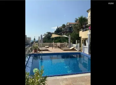 a large swimming pool in the middle of a building at Vila Anja in Dobra Voda