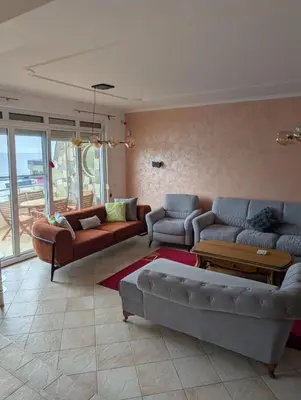 a living room with two couches and a couch at Vila Anja in Dobra Voda