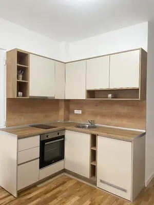 a kitchen with white cabinets and a sink at Le Vacanze in Ulcinj