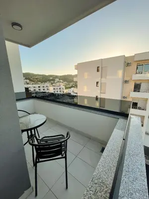 a balcony with a table and chair and a view at Le Vacanze in Ulcinj