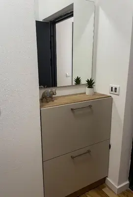 a bathroom with a dresser with a mirror at Le Vacanze in Ulcinj