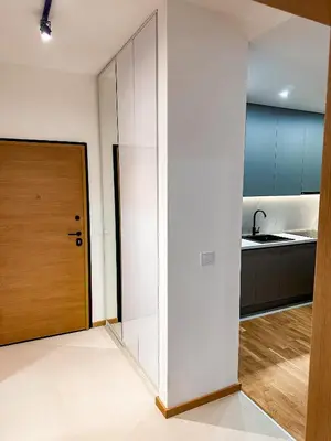 a room with a door and a kitchen at Enigma Apartment in Ulcinj