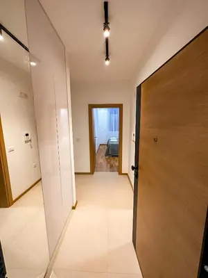 an empty hallway with a door and a room at Enigma Apartment in Ulcinj