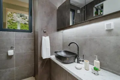 a bathroom with a sink and a mirror at Horizon Bay with Sea View in Kotor
