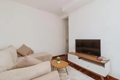 a living room with a couch and a flat screen tv at Horizon Bay with Sea View in Kotor