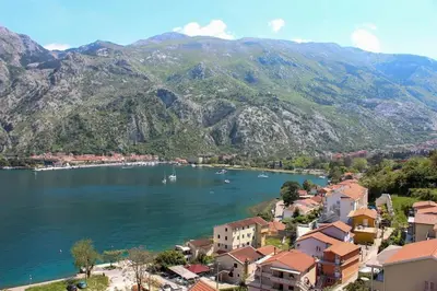 a view of a town next to a lake with mountains at Sea view and pool! Brend new! Vista in Kotor