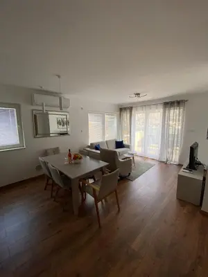 a living room with a table and a couch at Sea view and pool! Brend new! Vista in Kotor